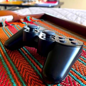 Selling an original black PS3 controller.